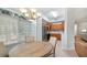 Charming dining area with a round table, four chairs, and a window with blinds at 102 Camino Real Blvd # 102, Howey In The Hills, FL 34737