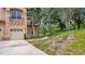 Exterior view of charming two-story home with attached garage at 102 Camino Real Blvd # 102, Howey In The Hills, FL 34737