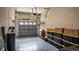 Spacious two-car garage, offering ample storage with installed overhead racks and clean epoxy flooring at 102 Camino Real Blvd # 102, Howey In The Hills, FL 34737