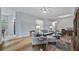 Spacious living area with hardwood floors, ample natural light, and comfortable furniture at 102 Camino Real Blvd # 102, Howey In The Hills, FL 34737