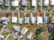 Aerial view of a 55+ community showing the layout of homes and streets at 1026 Capella Dr, Tavares, FL 32778