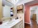 Simple bathroom with single sink, shower, and medicine cabinet at 1026 Capella Dr, Tavares, FL 32778