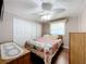 Relaxing bedroom with a queen-size bed and built-in dresser at 1026 Capella Dr, Tavares, FL 32778
