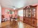 Bright dining area with wood table and hutch at 1026 Capella Dr, Tavares, FL 32778