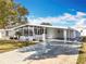 Clean exterior of a single-story home with a carport at 1026 Capella Dr, Tavares, FL 32778
