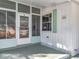Front door entrance with screened porch at 1026 Capella Dr, Tavares, FL 32778