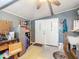 Garage with double doors and extra storage at 1026 Capella Dr, Tavares, FL 32778