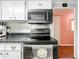 Updated kitchen with black stove and microwave at 1026 Capella Dr, Tavares, FL 32778