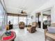 Relaxing sunroom featuring wicker furniture and tiled floors at 1026 Capella Dr, Tavares, FL 32778