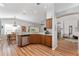 View of kitchen with stainless steel appliances and adjacent dining area at 12037 Ne 51St Cir, Oxford, FL 34484