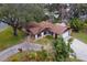 Aerial view of single-story home with driveway at 1208 Gibson St, Leesburg, FL 34748