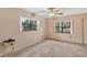 Bonus room featuring tile floors, ceiling fan, and natural light at 1208 Gibson St, Leesburg, FL 34748