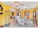 Bright dining area with a glass-top table and wood hutch at 1208 Gibson St, Leesburg, FL 34748