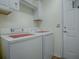 Laundry room with washer, dryer, cabinets and shelving at 12327 Se 92Nd Court Rd, Summerfield, FL 34491