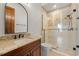 Bathroom featuring an oversized glass enclosed shower with beautiful tile surround and vanity at 15118 Pendio Dr, Bella Collina, FL 34756