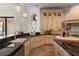 Large custom kitchen with granite countertops, stainless steel appliances, and custom cabinets at 15118 Pendio Dr, Bella Collina, FL 34756