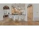 Chef's kitchen with custom cabinets, breakfast bar, and view to the open living space, ideal for gatherings at 15118 Pendio Dr, Bella Collina, FL 34756