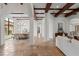 Spacious living area boasts stone floors, arched doorways, and exposed beam ceilings at 15118 Pendio Dr, Bella Collina, FL 34756