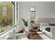 The bright main bedroom features large windows and a seating area at 15118 Pendio Dr, Bella Collina, FL 34756