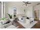 A large, bright main bedroom features a sitting area and backyard views at 15118 Pendio Dr, Bella Collina, FL 34756