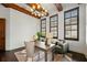 Office features wood floors, plantation shutters, neutral colors, and a door leading to another room at 15118 Pendio Dr, Bella Collina, FL 34756