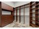 Custom walk-in closet features built-in shelving and drawers for maximum storage and organization at 15118 Pendio Dr, Bella Collina, FL 34756