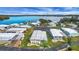 Community overview showing lakefront homes and landscaping at 16 Captains Pt, Fruitland Park, FL 34731