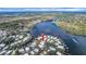 Aerial view showing home's location in waterfront community at 16 Captains Pt, Fruitland Park, FL 34731