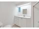 Bathroom with white vanity, a mirror, and a shower/tub combo at 16 Captains Pt, Fruitland Park, FL 34731