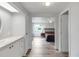 Clean bathroom with white vanity and view to bedroom at 16 Captains Pt, Fruitland Park, FL 34731