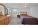 Bright bedroom with wood furniture and view at 16 Captains Pt, Fruitland Park, FL 34731