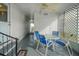 Relaxing covered patio with table and chairs at 16 Captains Pt, Fruitland Park, FL 34731