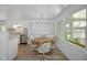 Dining area with a round table and four chairs, near the kitchen at 16 Captains Pt, Fruitland Park, FL 34731