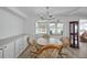 Bright dining room with a wooden table and four chairs at 16 Captains Pt, Fruitland Park, FL 34731