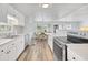 Open concept kitchen with island, stainless steel appliances, and dining area at 16 Captains Pt, Fruitland Park, FL 34731