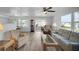 Bright living room features a comfy sofa, armchairs, and a coffee table at 16 Captains Pt, Fruitland Park, FL 34731