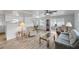 Living room with comfortable seating, hardwood floors, and large windows at 16 Captains Pt, Fruitland Park, FL 34731