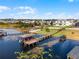 Aerial view of waterfront home with boat dock at 16428 Good Hearth Blvd, Clermont, FL 34711