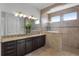 Elegant bathroom with double vanity and large walk-in shower at 16428 Good Hearth Blvd, Clermont, FL 34711