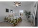 Bedroom features a ceiling fan, carpet, neutral paint, a window, and natural light at 16428 Good Hearth Blvd, Clermont, FL 34711