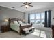 Main bedroom with water views, king-size bed, and ensuite bath at 16428 Good Hearth Blvd, Clermont, FL 34711