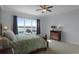 Serene bedroom with lake view and floral bedding at 16428 Good Hearth Blvd, Clermont, FL 34711