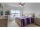 Bedroom with water view, and a ceiling fan at 16428 Good Hearth Blvd, Clermont, FL 34711