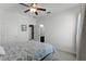 Bright bedroom with ensuite bathroom and ceiling fan at 16428 Good Hearth Blvd, Clermont, FL 34711