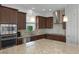 Modern kitchen with stainless steel appliances and granite countertops at 16428 Good Hearth Blvd, Clermont, FL 34711
