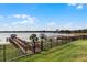 Expansive lakefront dock with multiple covered slips and a spacious deck at 16428 Good Hearth Blvd, Clermont, FL 34711
