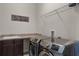 Laundry room with washer, dryer, and countertop space at 16428 Good Hearth Blvd, Clermont, FL 34711