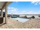 Captivating view of the pool and lake, perfect for relaxation and recreation with its spacious patio at 16428 Good Hearth Blvd, Clermont, FL 34711