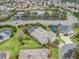 Aerial view of house, pool and surrounding neighborhood at 1644 Shell Point Ave, The Villages, FL 32162