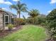 Landscaped backyard offering privacy and a peaceful atmosphere at 1644 Shell Point Ave, The Villages, FL 32162